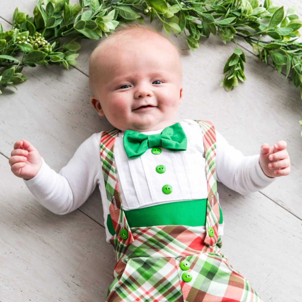 Baby wearing a Bebe Couture Baby Plaid Christmas Tuxedo