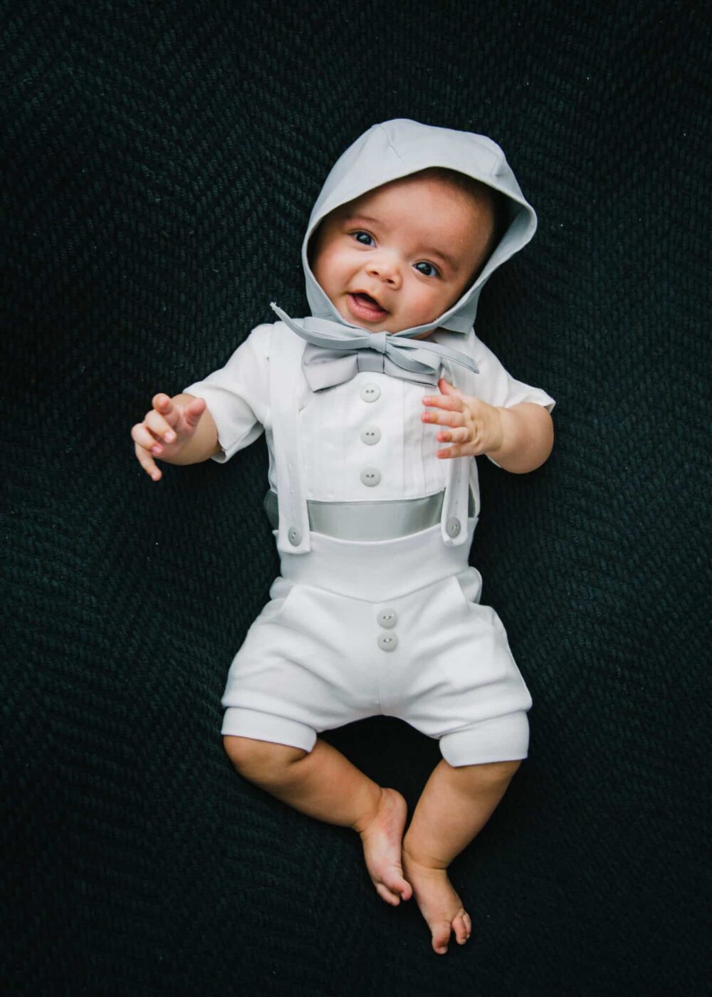 Baby boy in gray baby bonnet