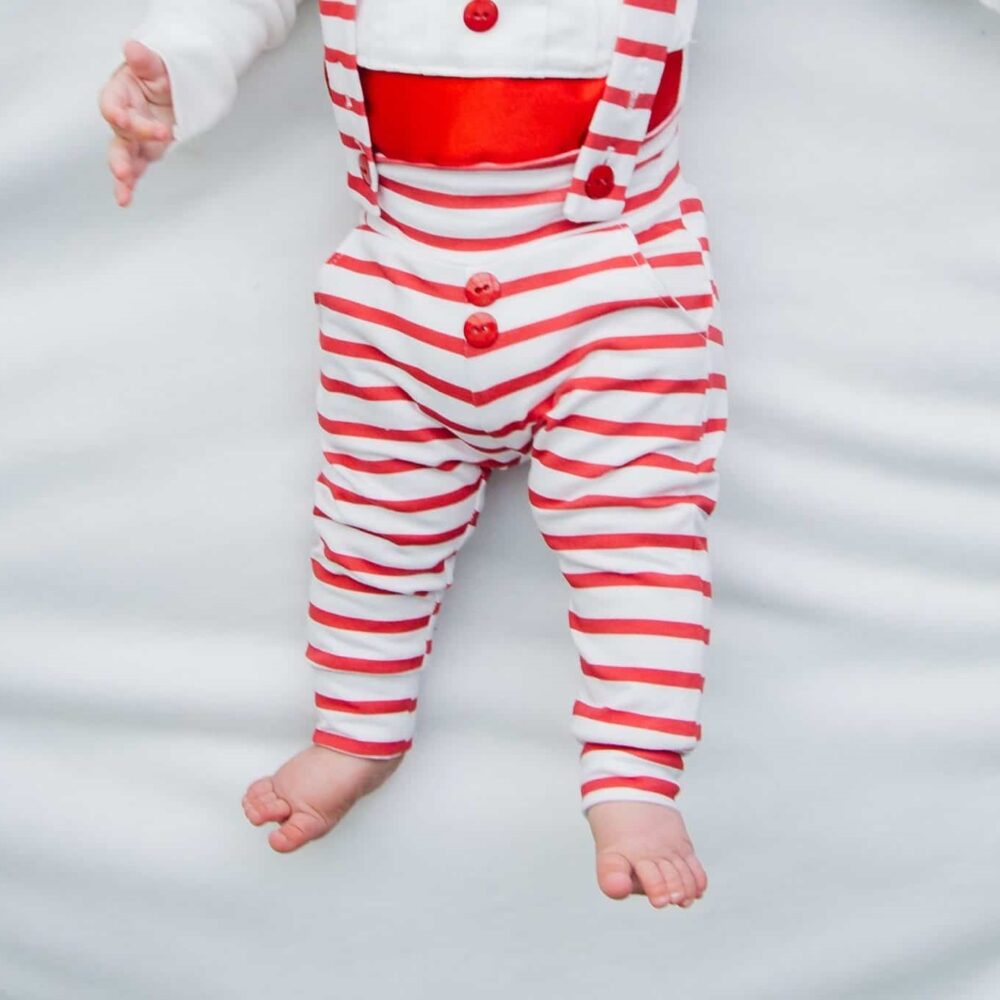 baby boy wearing a Bebe Couture red and white striped holiday outfit