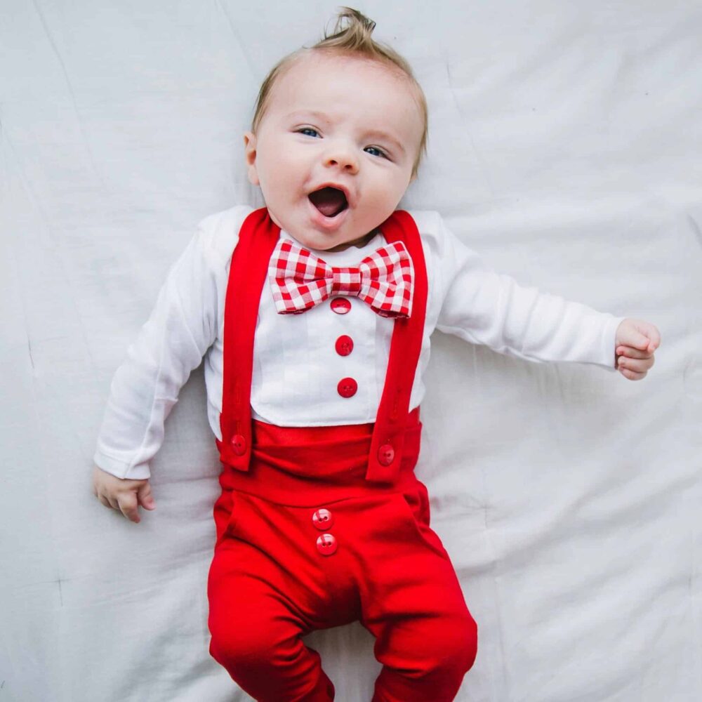 Baby boy wearing a red and white christmas or valentines day outfit