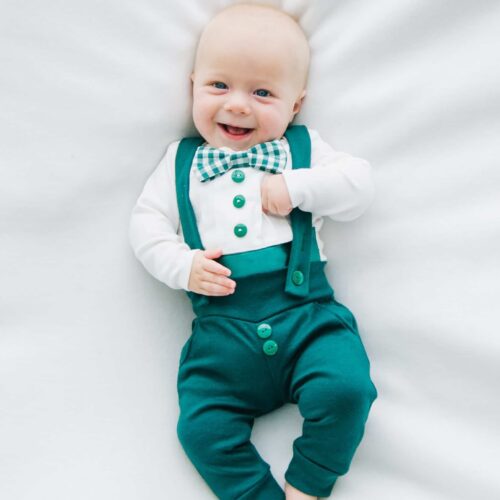 baby wearing Bebe Couture baby boy green Christmas outfit with bow tie