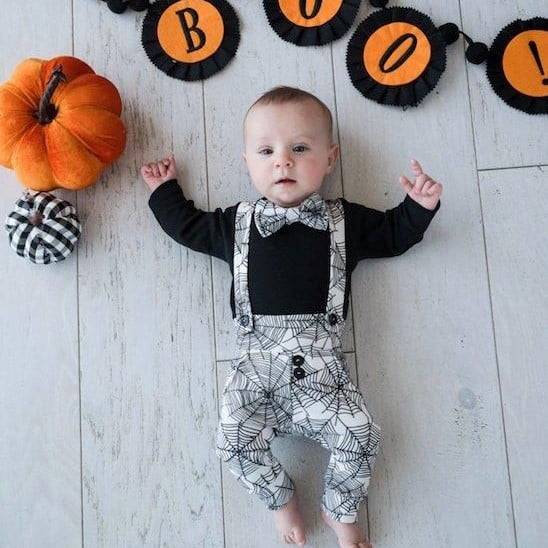 baby halloween outfit with spiderweb print and bow tie