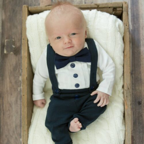 baby boy in navy blue tuxedo