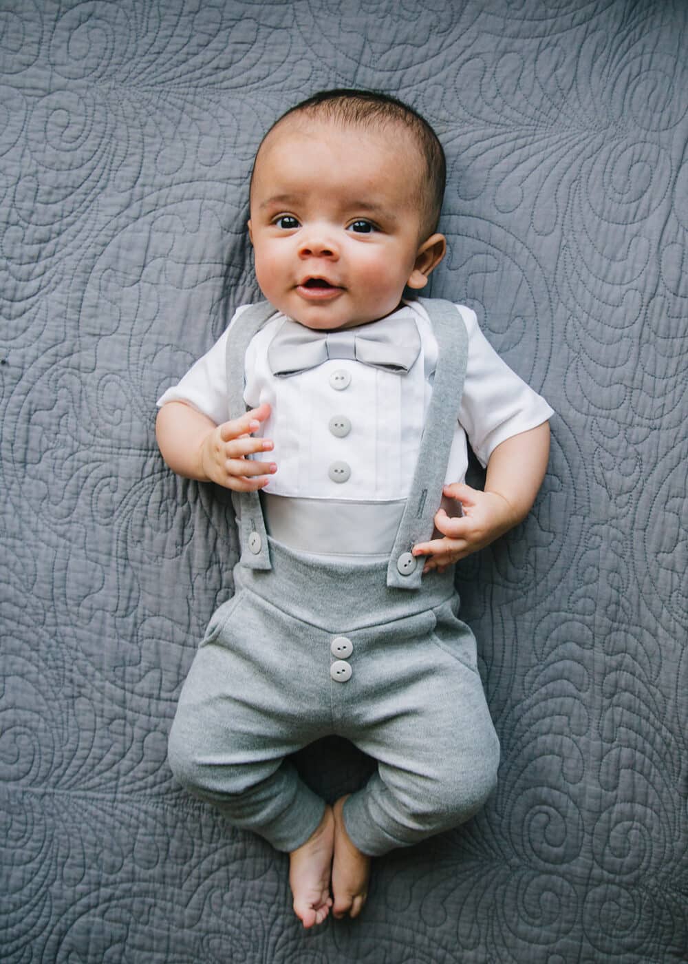 Baby boy wearing grey leggings